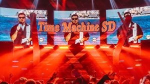 people at a concert with neon lights